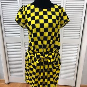 Yellow and black checkered dress with bow/pockets.